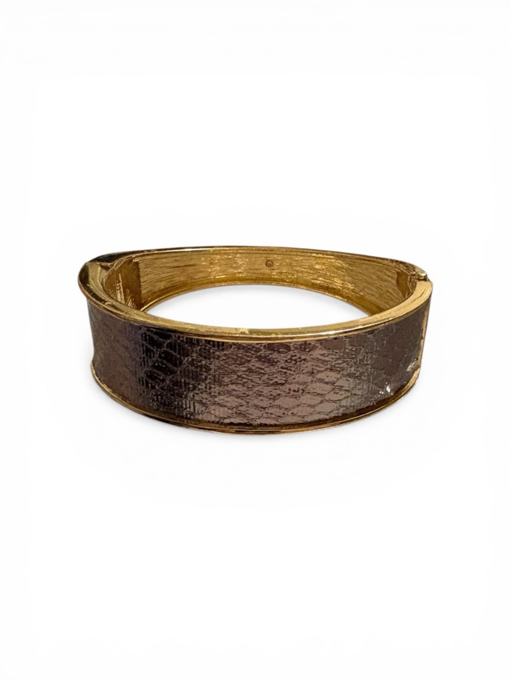 Nine West gold-tone bangle with a textured snakeskin-patterned inlay.